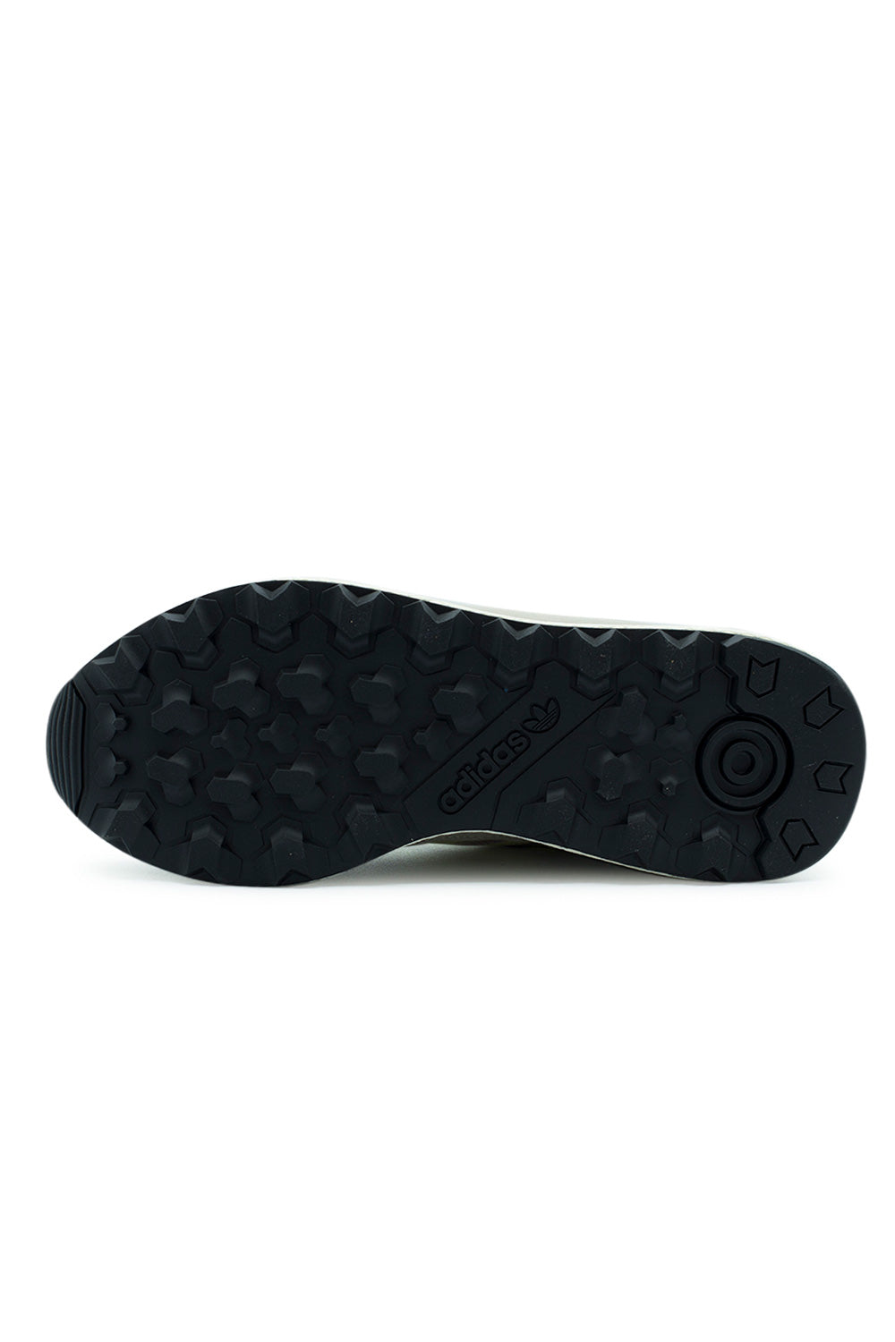 Full bottom perspective of the black rubber outsole on the Adidas Oregon Ultra Tech, featuring aggressive trail-ready geometric multi-directional traction lugs, circular heel pivot suction pad, and an embossed central Adidas Trefoil brand logo