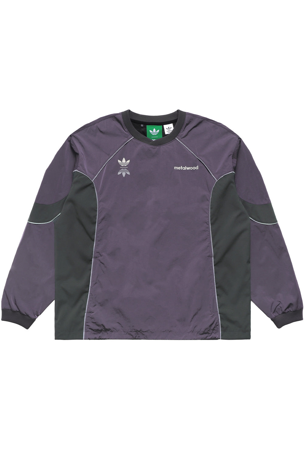 Adidas x Metalwood purple crew sweatshirt front view with oversized fit, reflective piping, chest logos, and technical streetwear design inspired by golf and skate culture.
