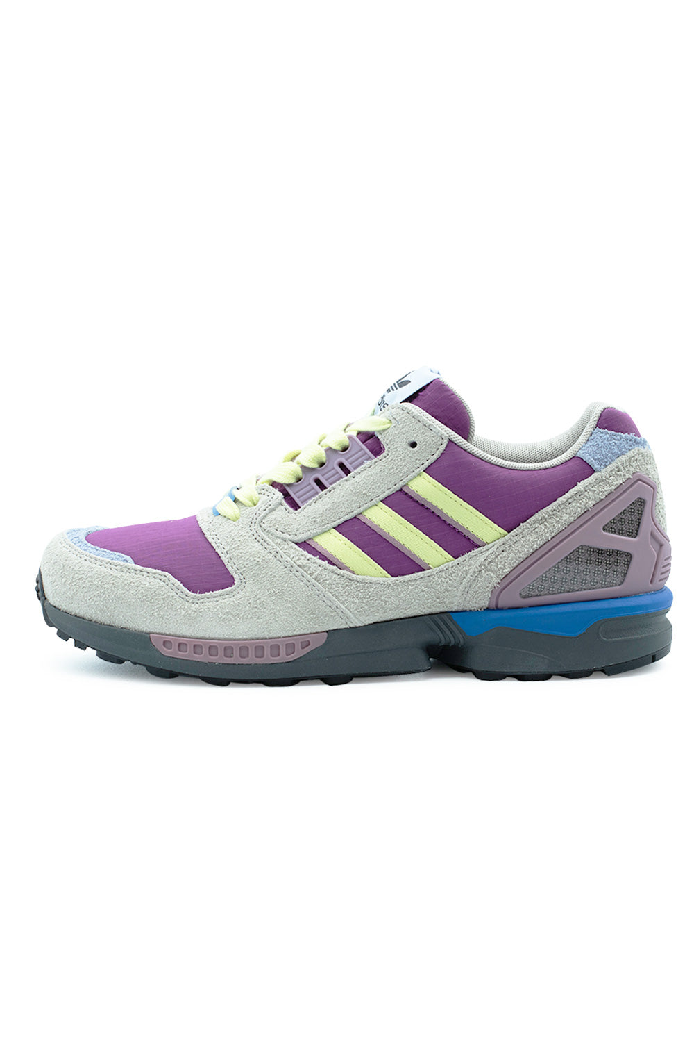 Lateral profile view of the Adidas ZX 8000 sneaker in Lucky Pink, Yellow Tint, and Grey Six, showcasing the light grey textured hairy suede overlays, magenta pink ripstop base, pale yellow smooth leather Three Stripes, external purple TPU heel counter cage, bright blue midsole heel insert, and dark grey cushioned EVA midsole.