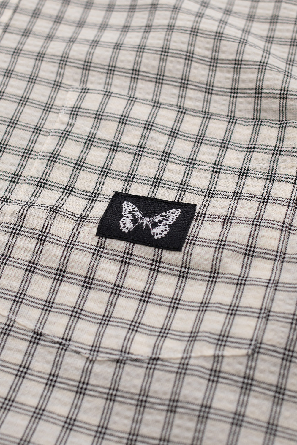 Summit white Bye Jeremy Supper Button Up Shirt with fine black check pattern, wide silhouette and chest pocket branding, crafted from premium lightweight cotton.