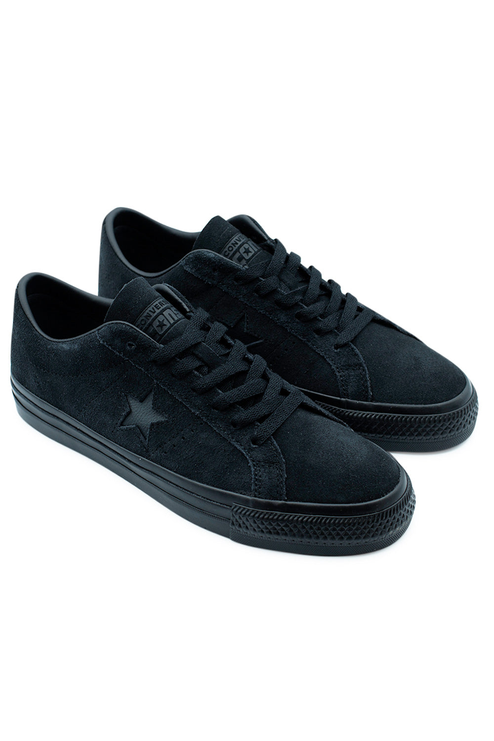 Angled product shot of the Converse One Star Pro OX black suede skate shoe highlighting its low-profile silhouette, grippy rubber outsole, and signature monochrome One Star design.