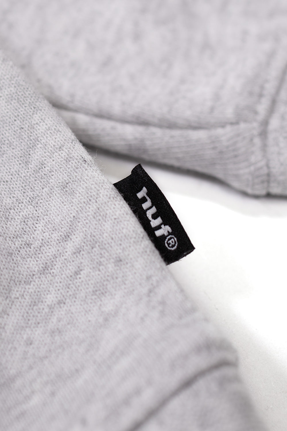 Metal Gear Solid MGS1 collaboration hoodie by HUF, grey pullover with front logo print and bold back panel artwork