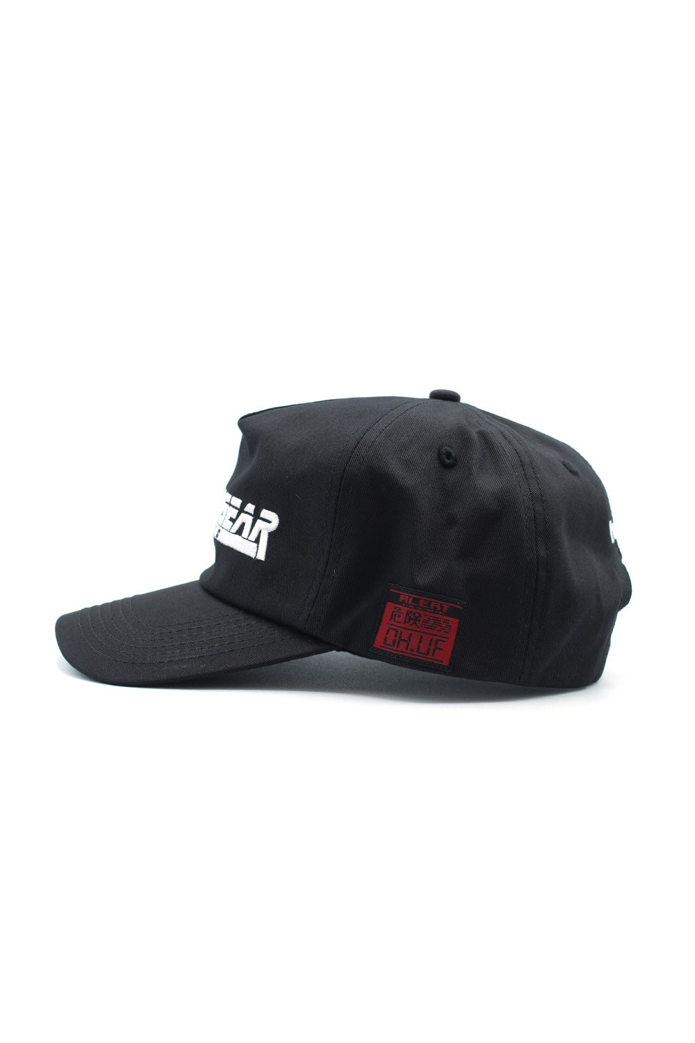 Side angle of black Metal Gear Solid snapback hat showing curved brim, structured crown, and iconic stealth-action video game branding