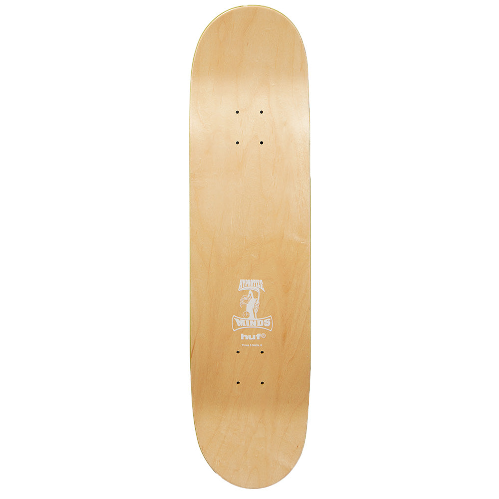 Top side view of the Huf X Three 6 Mafia skateboard deck, displaying the clean natural light maple wood grain veneer, pre-drilled truck mounting holes, and a centered white screen-printed collaboration graphic featuring the Hypnotize Minds grim reaper emblem above the lowercase "huf®" logo.