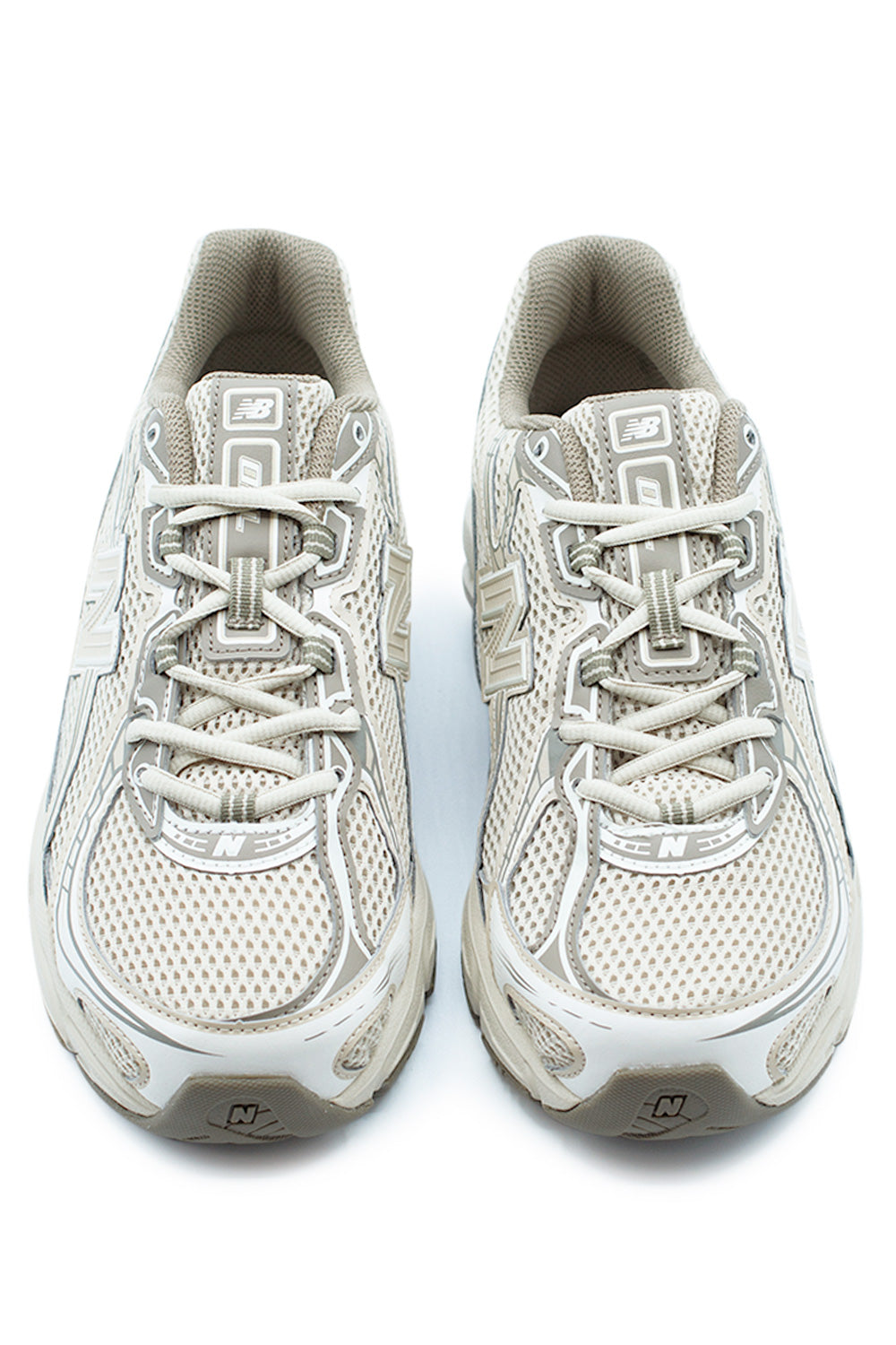 Front view of New Balance 740 running-inspired sneaker in Dockside and Sea Salt colorway, highlighting the open knit mesh toe box, quick lace system and early-2000s performance runner design.
