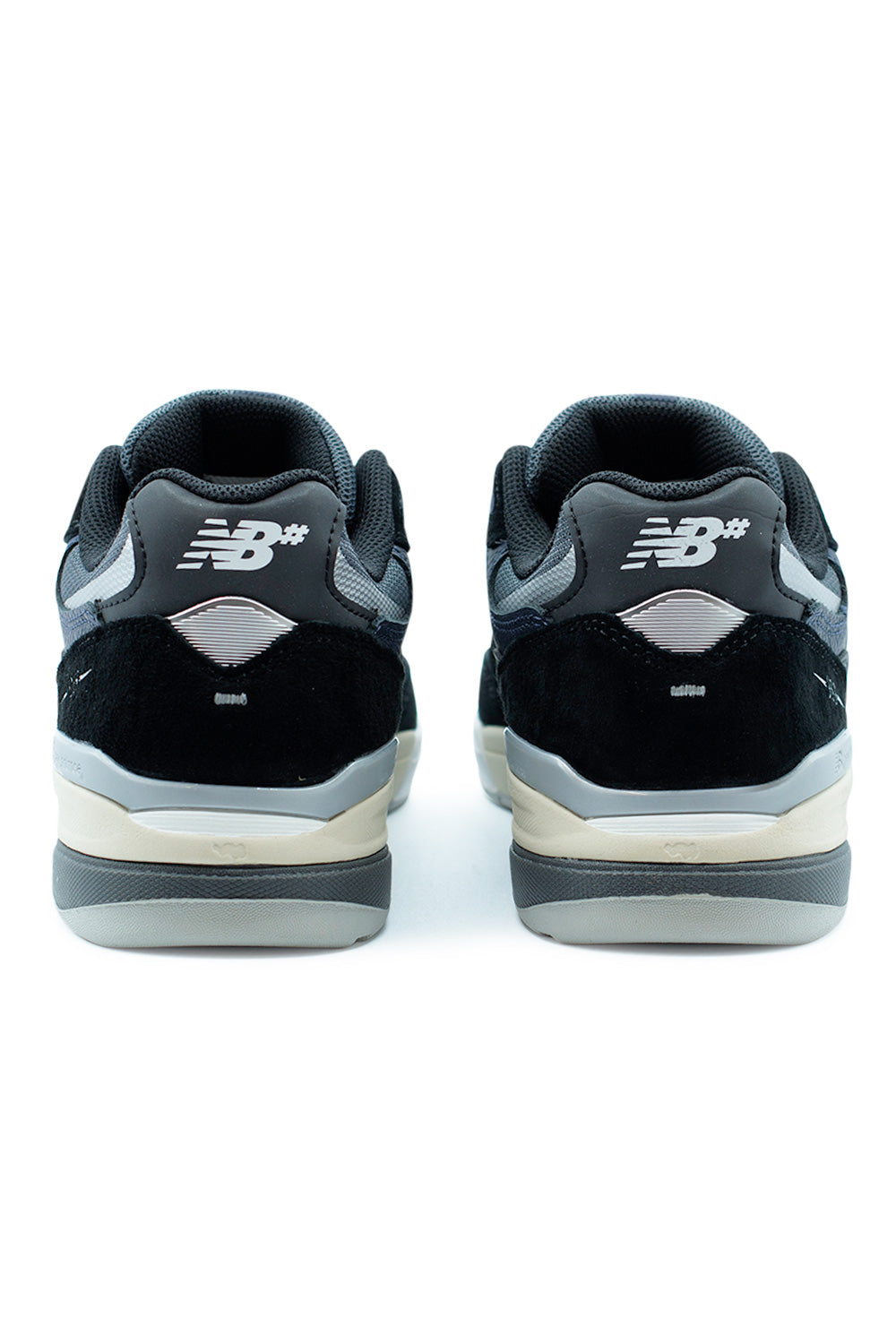Rear view of New Balance Numeric 933 Andrew Reynolds Black Eclipse showing padded collar, reinforced heel counter, and classic running-inspired silhouette