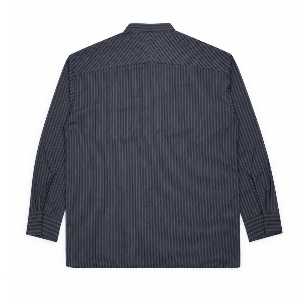 Back studio flat lay perspective of the Oakley FGL Fuel LS Shirt 6.7 in Phantom, highlighting the chevron chevron-striped split shoulder yoke, clean straight back drape, and long sleeves tailored with pleated buttoned cuffs.