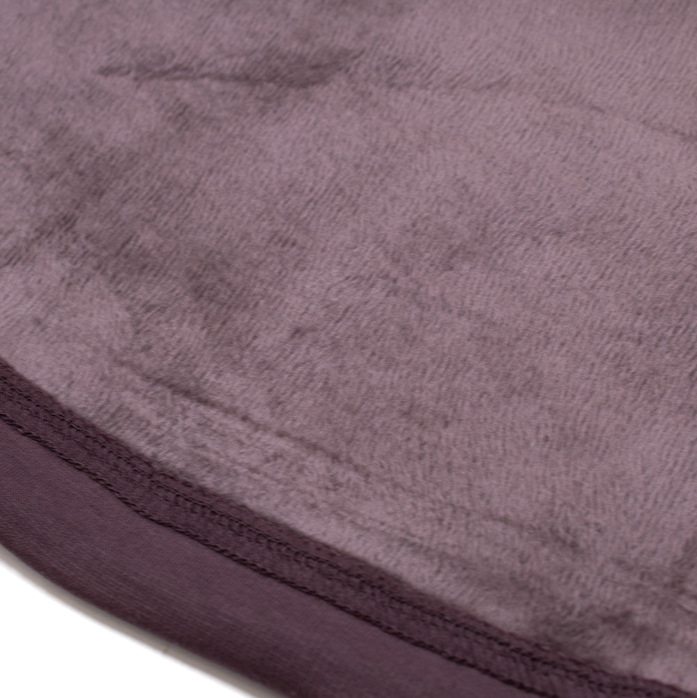 Macro studio close-up of the interior lining and hem on the Oakley FGL Slick Fleece Hoodie, highlighting the ultra-soft, high-pile plush sherpa fleece backing paired with double-stitched stretch edge finishing.