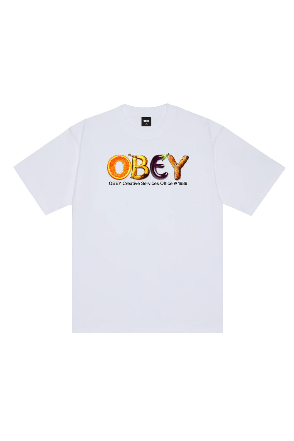 Front view of the white Obey Creative Services Office T-Shirt, made from heavy 8oz 100% cotton jersey with a loose boxy fit, displaying a colorful chest graphic featuring the letters O, B, E, and Y shaped as an orange slice, bananas, an eggplant, and a carrot root above black subtext.