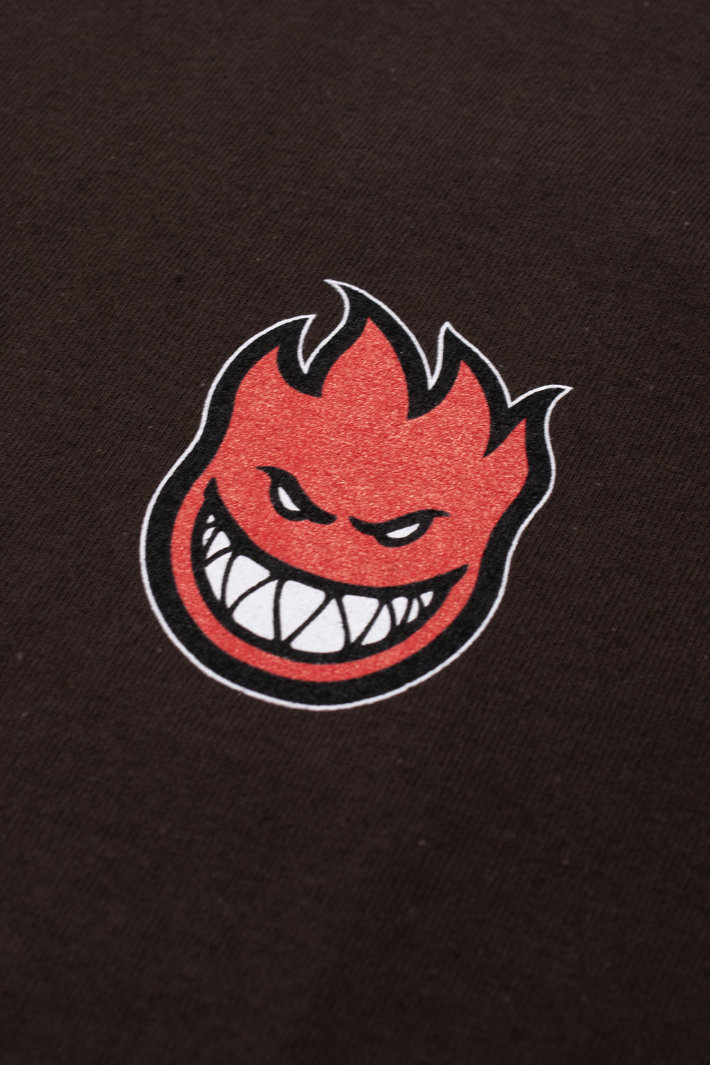 "Dunkelbraunes Spitfire Wheels T-Shirt mit kleinem Bighead-Logo auf der Brust"