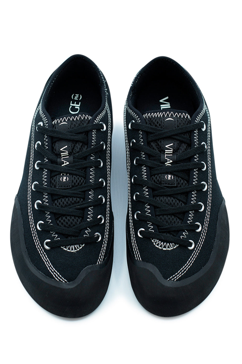 Top view of Village PM 1.30PM Black Natural Black skateboard shoe with extended lacing system, breathable mesh tongue and asymmetrical precision fit for enhanced board control