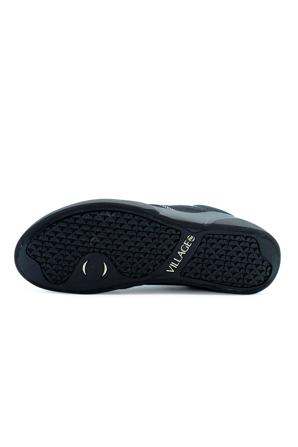 Village PM 1PM Mid Black Natural Black skate shoe outsole close-up featuring durable rubber traction pattern designed for grip, quick break-in and precise skateboard board control