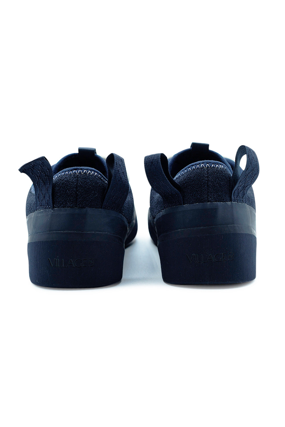 Rear view of Village PM 1PM Navy Navy skate shoes highlighting embroidered heel pull tabs, padded collar and durable rubber outsole with Village PM branding