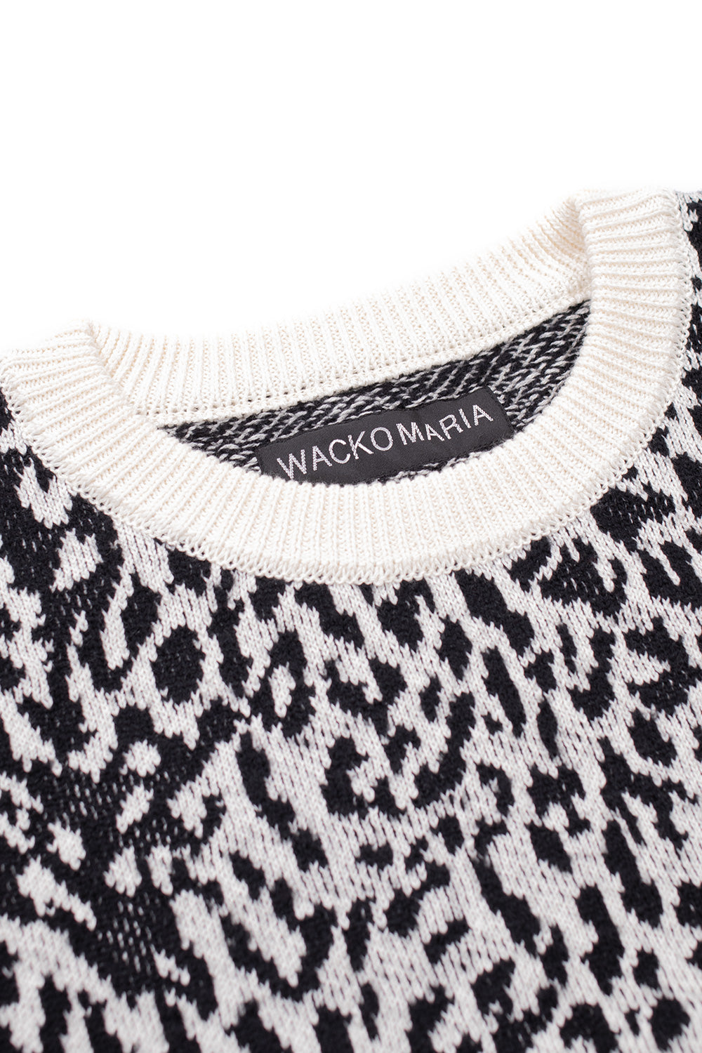 close up crew neck of Wacko Maria white leopard knit sweater, premium jacquard fabric with ribbed collar in cotton wool blend