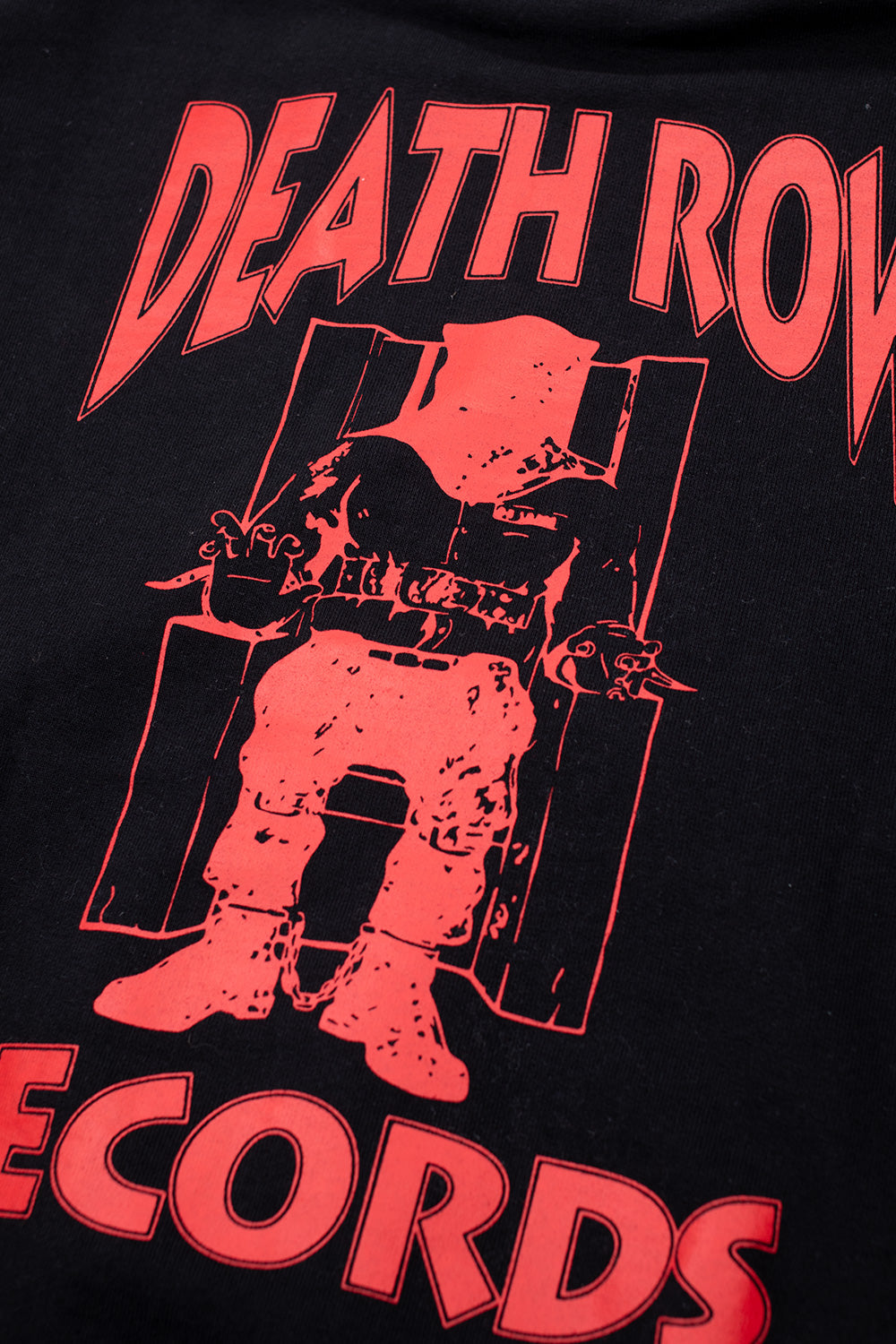 close up Death Row Records electric chair graphic in red on black hoodie, iconic hip hop logo print on premium heavyweight cotton fabric