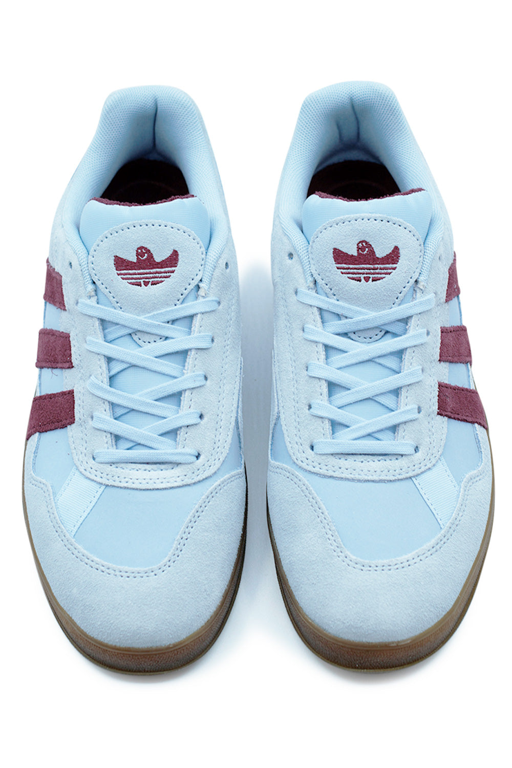 Close-up of Adidas Aloha Super tongue with logo and heel featuring MG embroidery in Clear Sky Maroon.