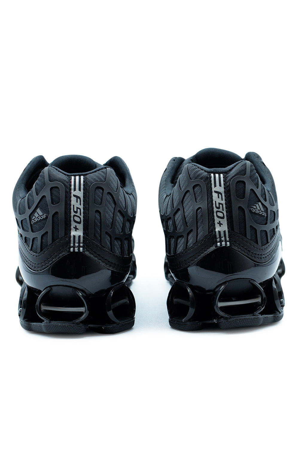 Rear view of Adidas Megaride F50 Core Black highlighting F50 branding, supportive heel construction, and dual-injected TPU cushioning for stability and shock absorption