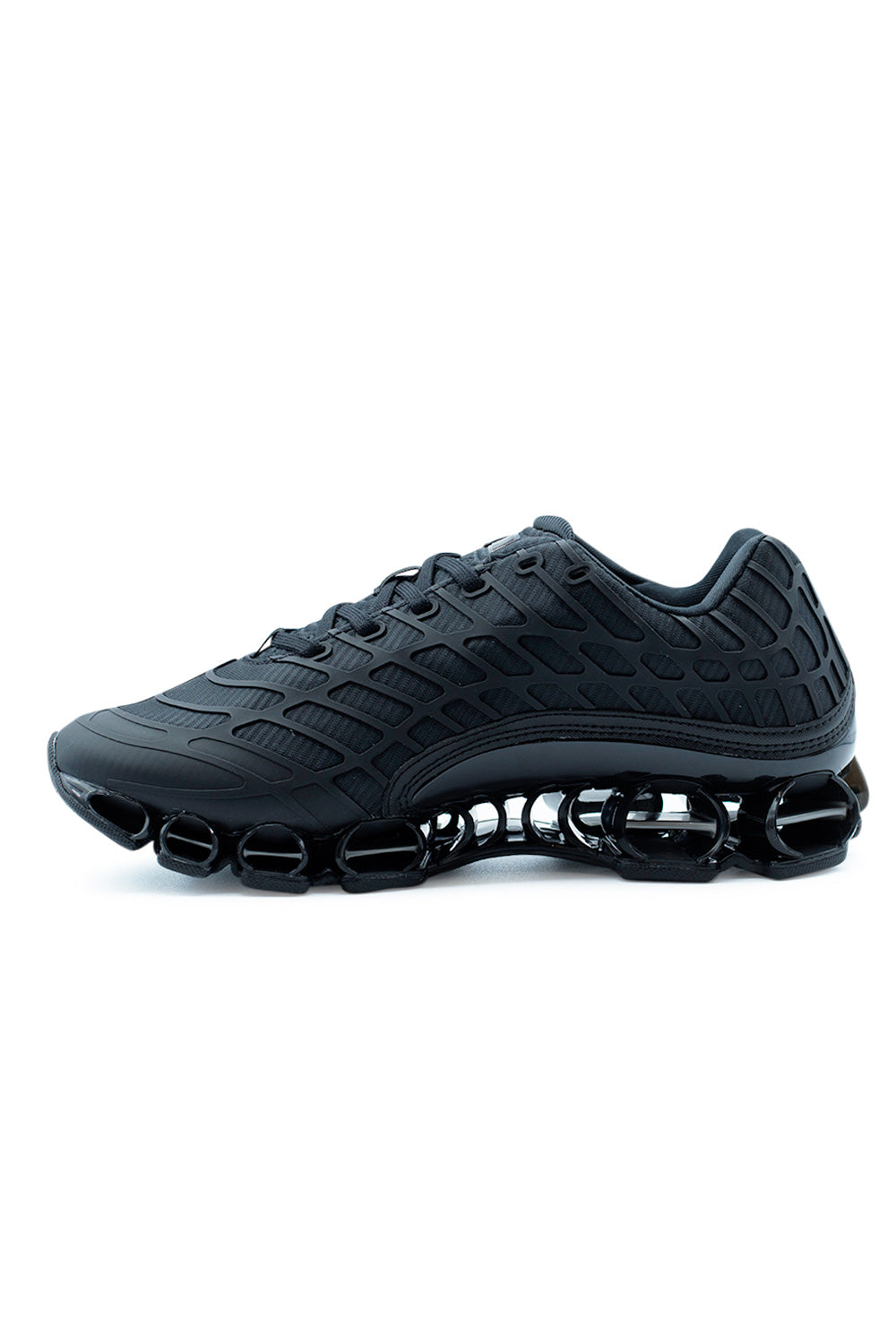 Detailed side angle of Adidas Megaride F50 Core Black showing layered synthetic overlays, breathable mesh zones, and Megaride midsole inspired by performance running shoes