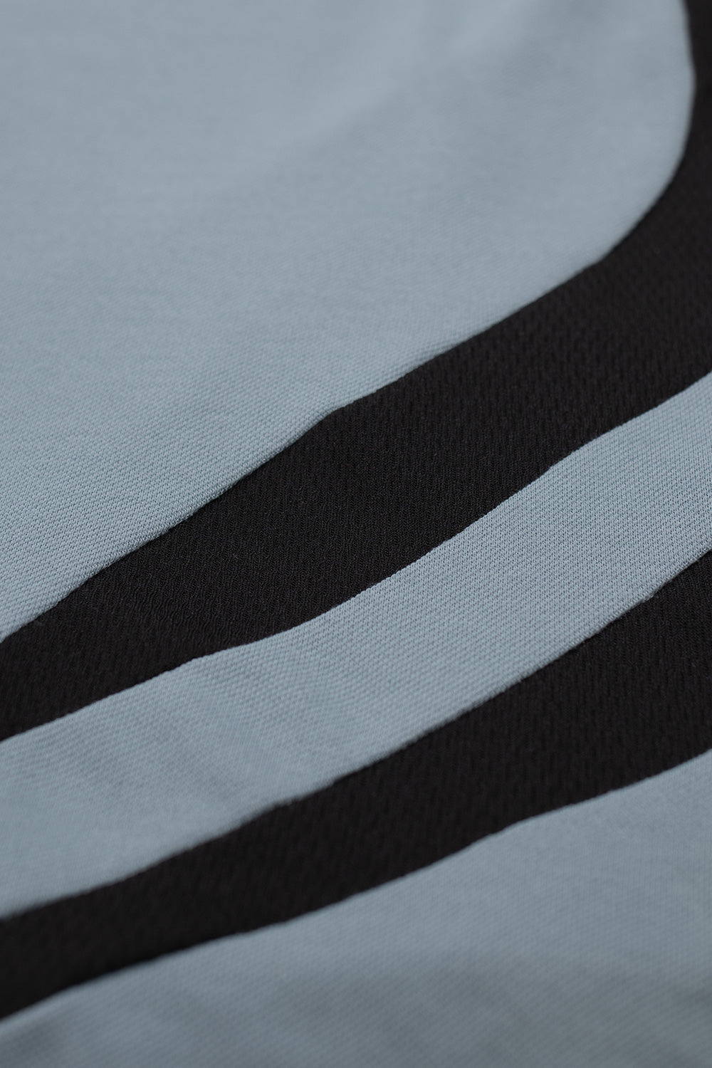 Breathable mesh panel detail on adidas x Metalwood polo Green Earth designed for ventilation and comfort, blending skate culture attitude with modern golf performance styling