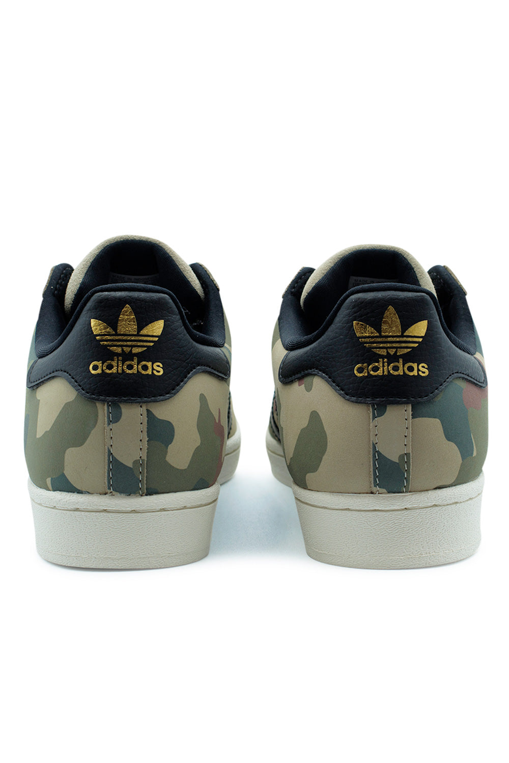 Rear angle of the adidas Superstar ADV Khaki Three / Core Black / Chalk White displaying the black leather heel tab with metallic gold Trefoil logo, camo print heel panel and stitched rubber cupsole built for skateboarding durability.