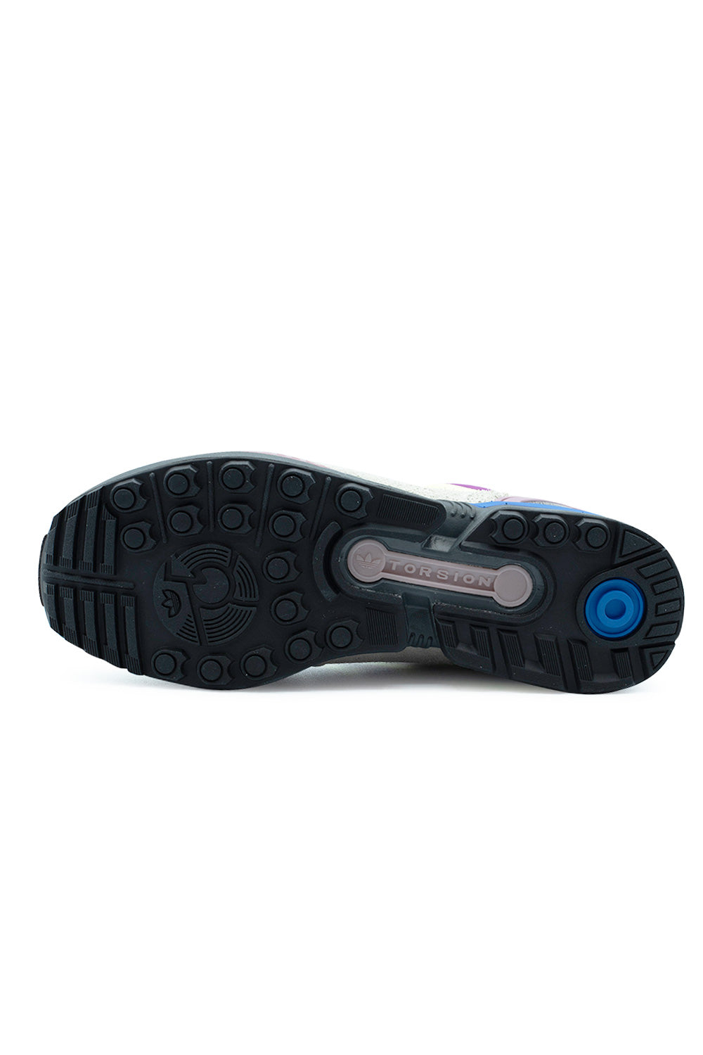 Full bottom view of the dark grey rubber outsole on the Adidas ZX 8000, displaying the multidirectional circular lug pattern, round blue heel impact pod, and the iconic bone-shaped Adidas Torsion stability bar integrated into the midfoot shank.