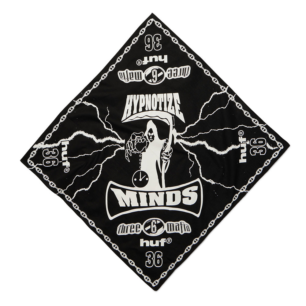 Full diamond flat lay view of the black and white Huf X Three 6 Mafia Hypnotize Minds Bandana, showcasing a graphic square cotton scarf bordered by a nautical link chain with repeated "36" and "huf®" corner hits, surrounding a central Hypnotize Minds hooded grim reaper clutching a sickle and hourglass, framed by arched brand typography and crackling white lightning strikes across the dark background.