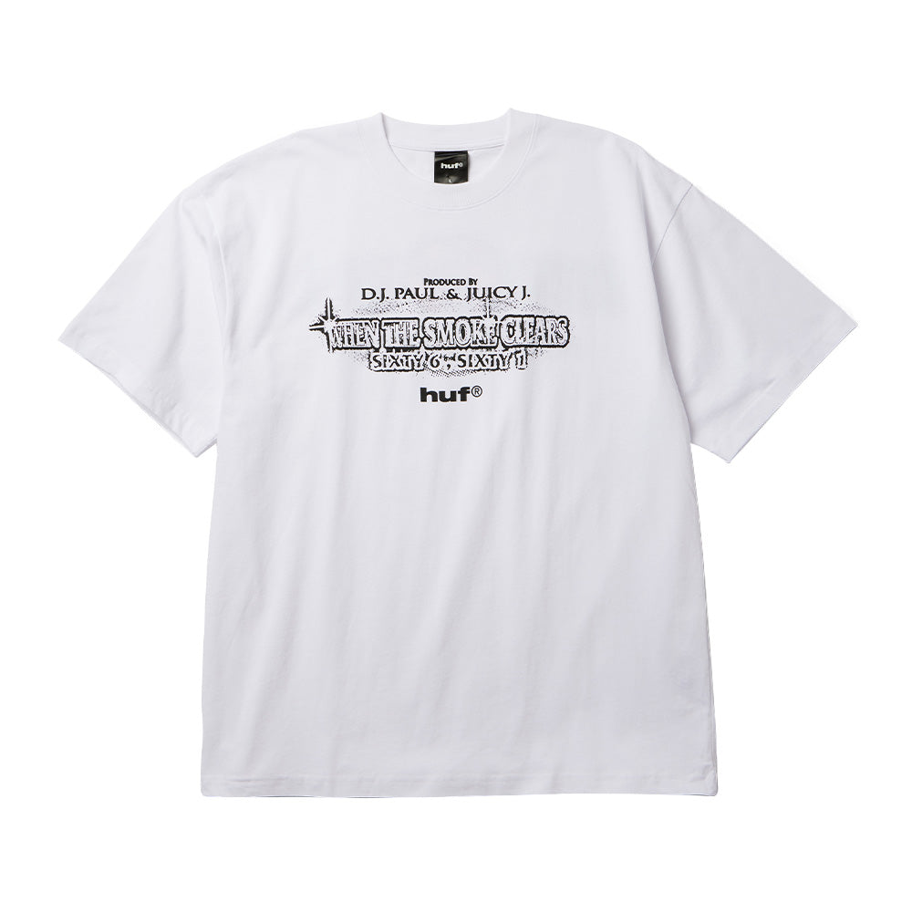 Front flat lay view of the white Huf X Three 6 Mafia Smoke Clears T-Shirt, displaying a relaxed short-sleeve cut, ribbed crewneck collar, and black center-chest graphic print featuring "PRODUCED BY D.J. PAUL & JUICY J.", distressed album title lettering "WHEN THE SMOKE CLEARS SIXTY 6, SIXTY 1", and the bold lowercase "huf®" logo.