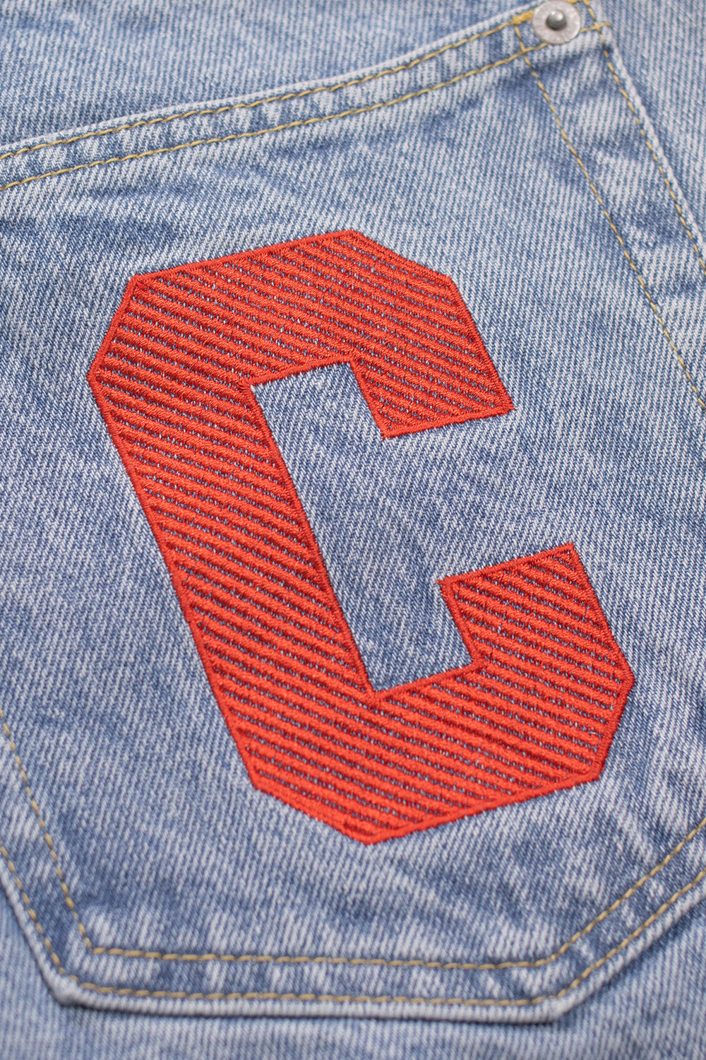 Light blue denim shorts by Ice Cream with bold red running dog artwork