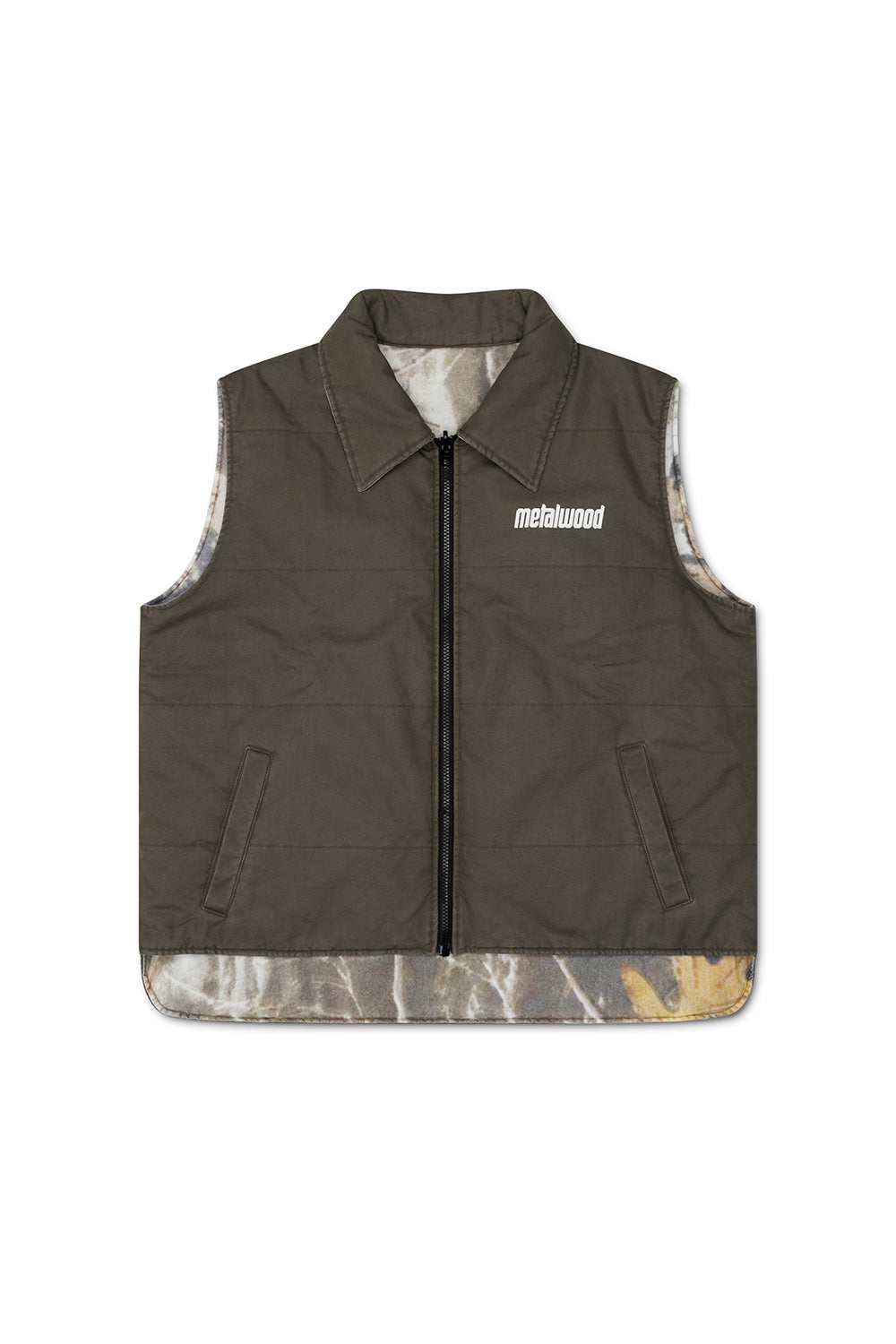 Metalwood Studio reversible vest in fatigue green with modern detailing, perfect for layering in cooler weather.