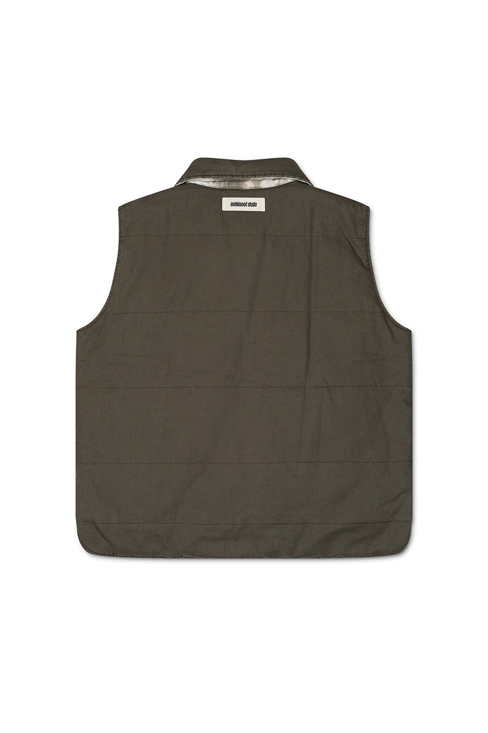 Functional and fashionable Metalwood Studio poly-filled vest in fatigue green, ideal for outdoor and streetwear outfits.