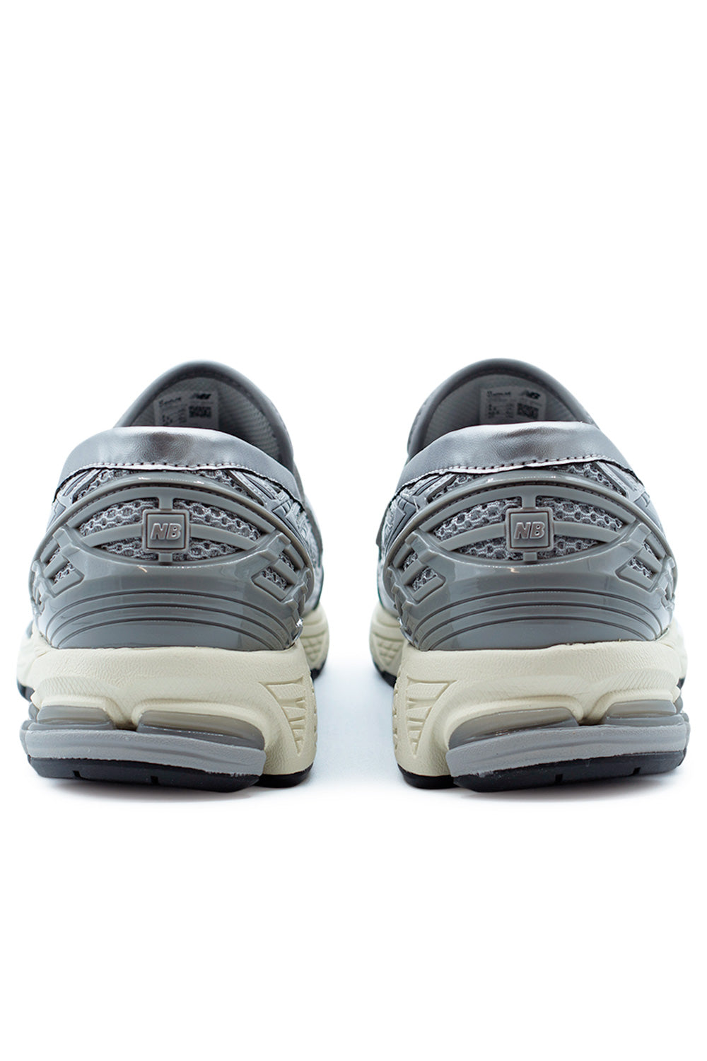 Rear view of the New Balance 1906L loafer showcasing ABZORB-SBS heel cushioning, N-ergy outsole technology and sculpted performance sole in Turtledove and Shadow Grey.