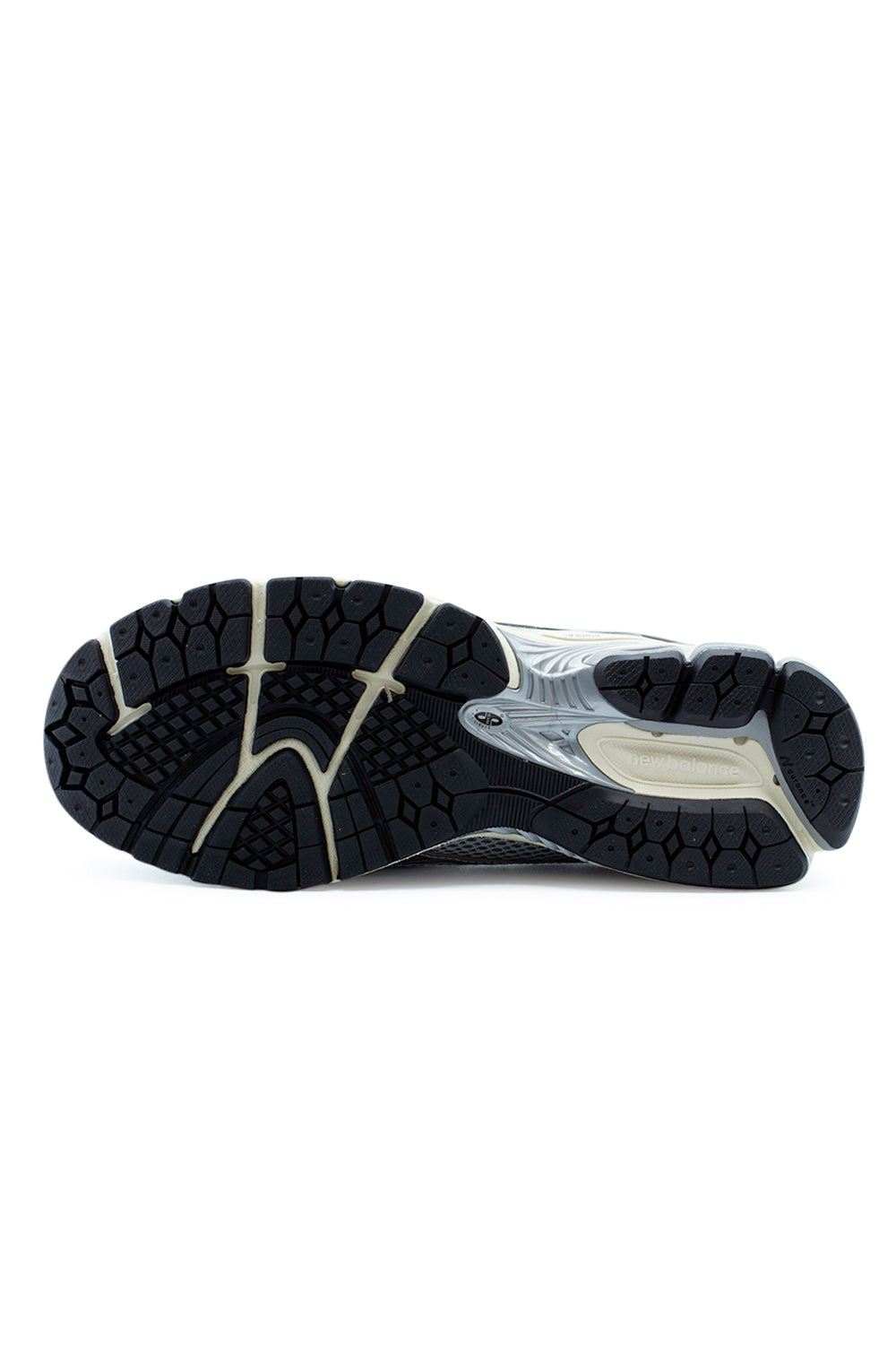 Outsole view of the New Balance 1906L loafer sneaker featuring durable rubber tread, N-ergy shock absorption system and performance-driven traction pattern.