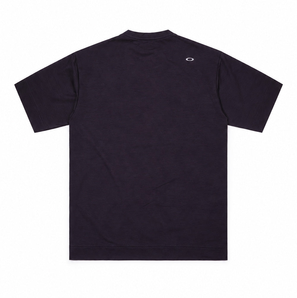 Back studio flat lay perspective of the Oakley FGL Scratch SS Tee 6.7 in Phantom, displaying the clean shoulder seam construction, straight hemline, fine melange texture of the technical knit jersey, and a reflective silver heat-sealed Oakley Ellipse logo centered beneath the back collar seam.
