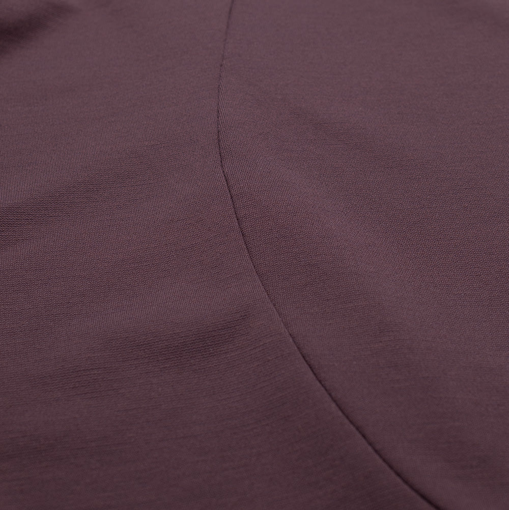 Close-up shot of the curved ergonomic panel stitching on the Oakley FGL Union Tee, highlighting the dense, breathable performance knit weave and clean tonal flatlock seam construction designed for active movement.
