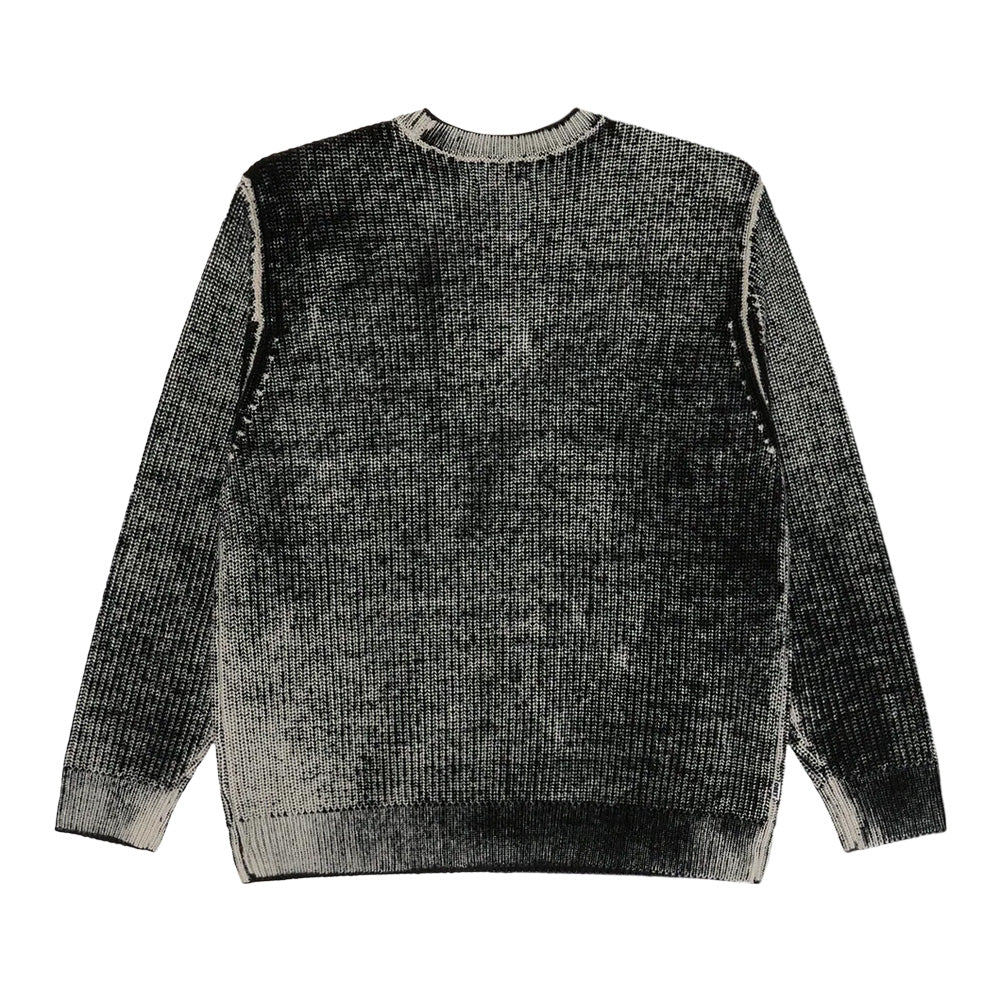 Back flat lay view of the Obey Spray Effect Sweater in Dark Black, highlighting the textured vertical rib-knit construction with an ombré spray gradient across the back panel and sleeves, framed by off-white reverse overlock seam detailing along the dropped shoulders and a solid ribbed collar band.