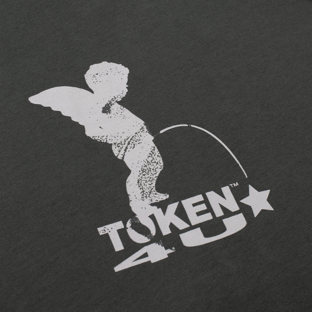 Detailed macro studio close-up of the front chest graphic on the Token Angelic T-Shirt, highlighting the textured white screen-print of the winged cherub statue and the bold distressed block typography reading "TOKEN 4U" with a star icon against dark midnight green cotton jersey fabric.