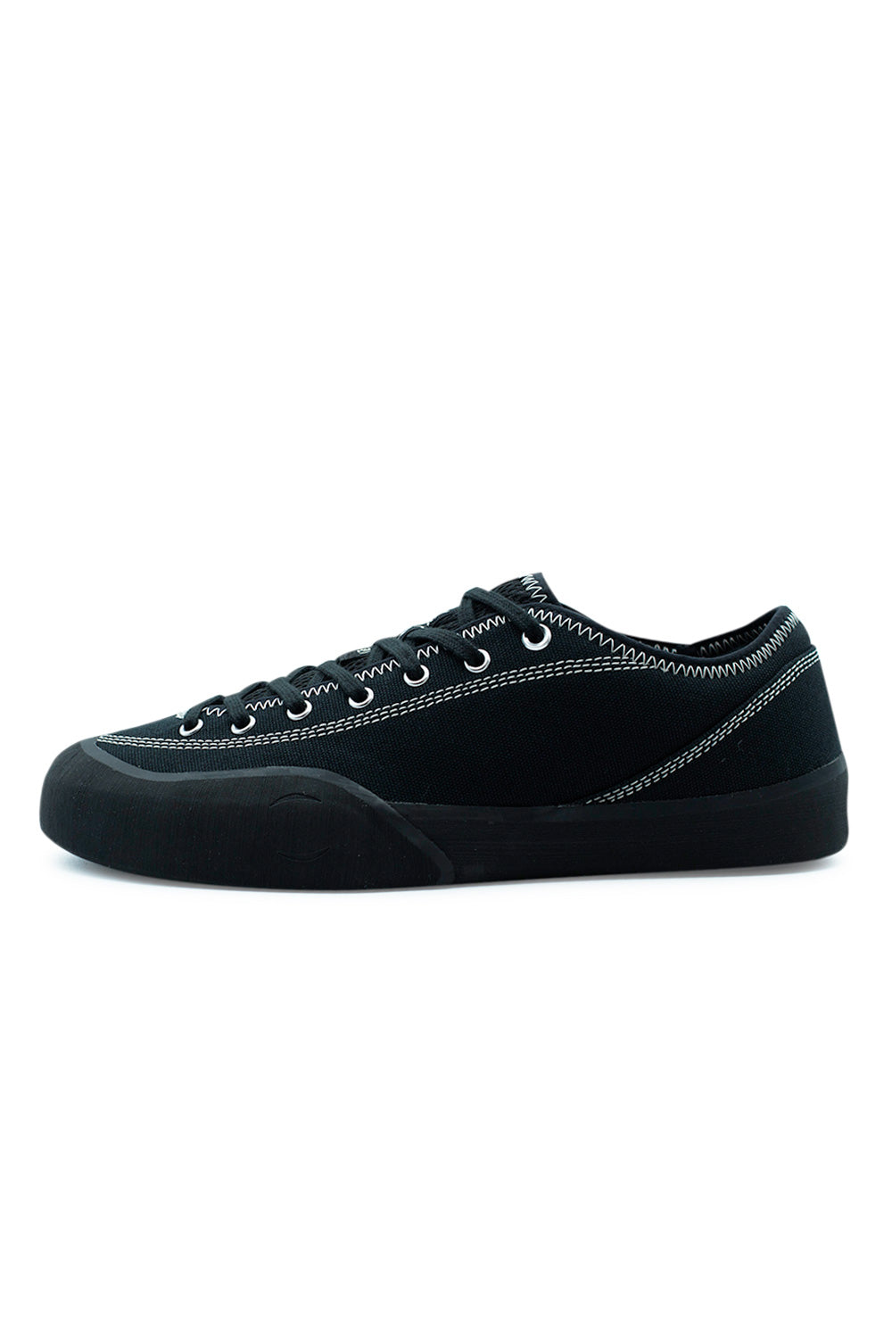 Village PM 1.30PM Black Natural Black skateboarding shoe side profile with durable canvas upper, Rubber Glove Technology rubber wrap and minimalist technical skate sneaker design